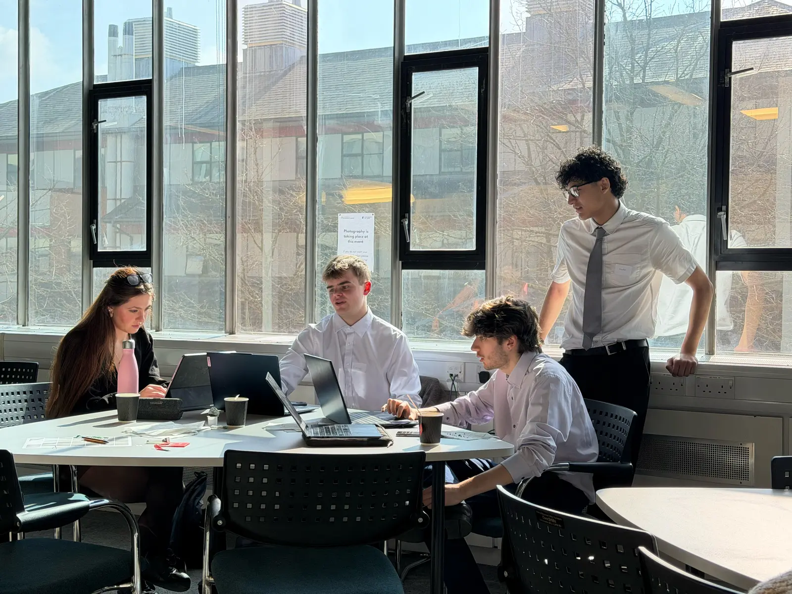 Students collaborating on laptops during a Discover Enterprise session