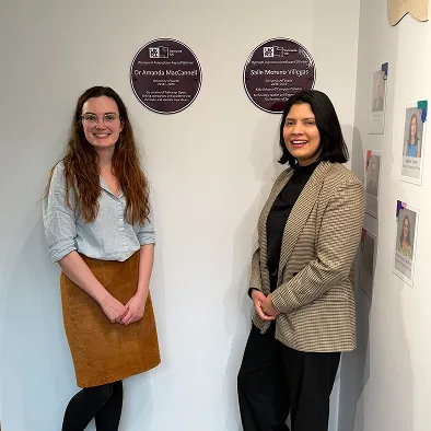 Dr Amanda MacCannell and Saile Villegas with their Innovate UK Women in Innovation Purple Plaques